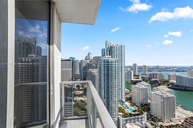balcony featuring a water view and a view of city