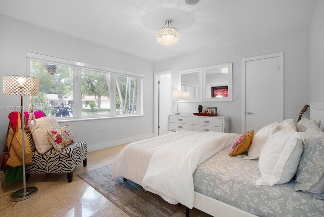 1523 Blue Rd, Coral Gables, FL 33146 - bedroom featuring speckle patterned floor, a chandelier, and baseboards