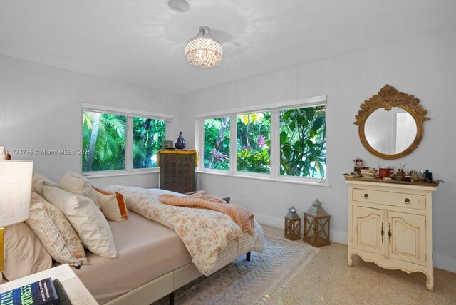 1523 Blue Rd, Coral Gables, FL 33146 - bedroom with light carpet and a chandelier