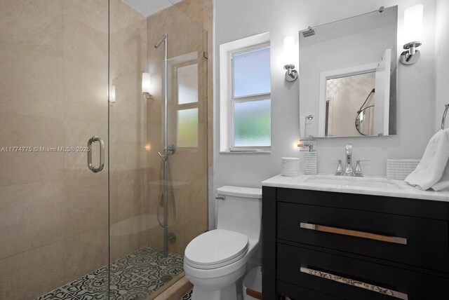 1523 Blue Rd, Coral Gables, FL 33146 - bathroom featuring a shower stall, vanity, and toilet