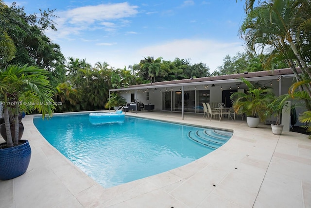 1523 Blue Rd, Coral Gables, FL 33146 - outdoor pool with ceiling fan and a patio area