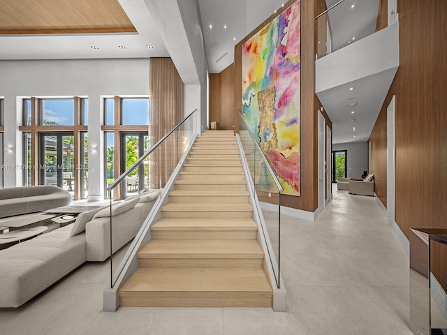 5700 SW 91st St, Pinecrest, FL 33156 - staircase featuring baseboards, recessed lighting, and a towering ceiling