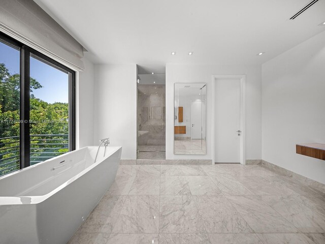 5700 SW 91st St, Pinecrest, FL 33156 - bathroom featuring a freestanding bath, a walk in shower, marble finish floors, and recessed lighting