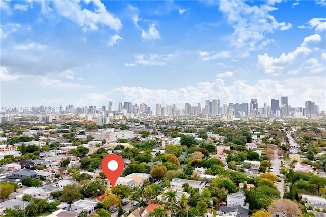 birds eye view of property with a view of city