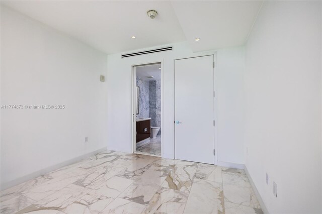 15701 Collins Ave Unit 1004, Sunny Isles Beach, FL 33160 - unfurnished bedroom with recessed lighting, light marble finish flooring, and ensuite bathroom