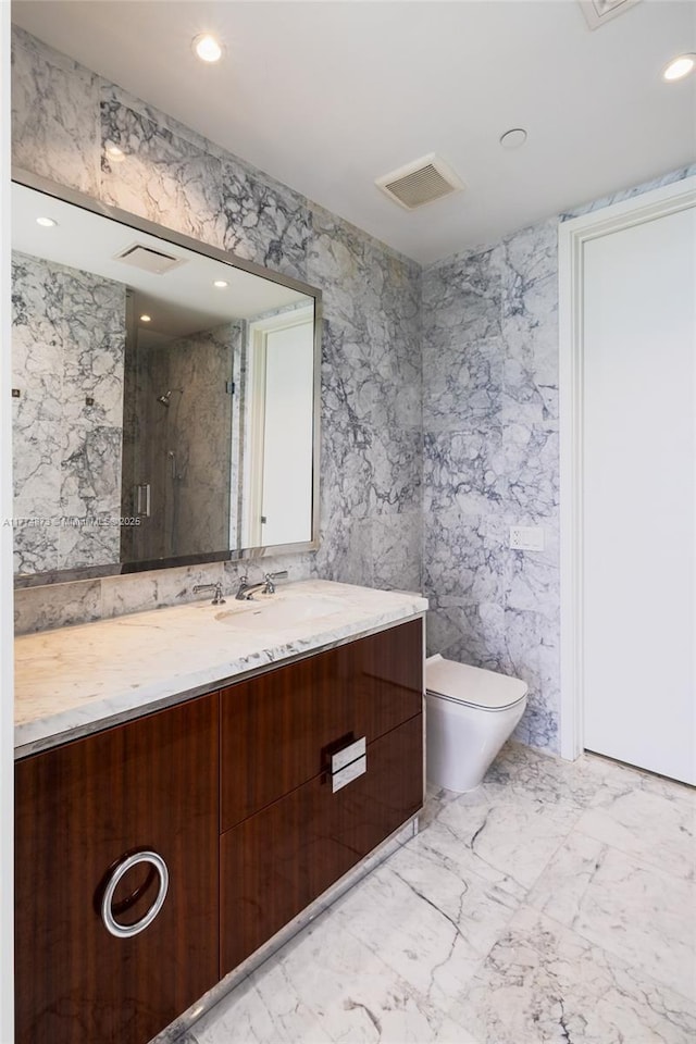 15701 Collins Ave Unit 1004, Sunny Isles Beach, FL 33160 - full bathroom featuring a shower stall, toilet, marble finish floors, recessed lighting, and vanity