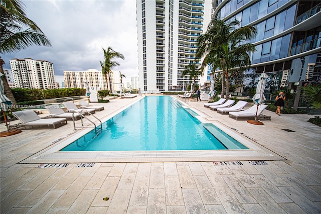15701 Collins Ave Unit 1004, Sunny Isles Beach, FL 33160 - community pool featuring a patio and a view of city