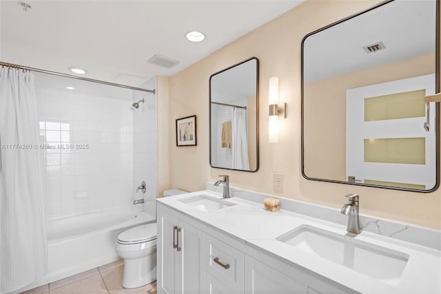 bathroom featuring shower / bath combo, visible vents, a sink, and toilet