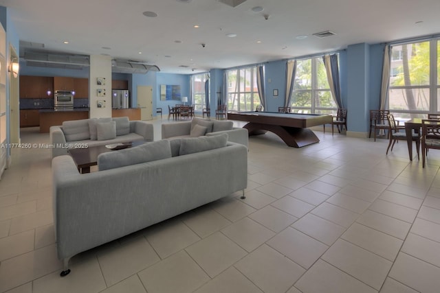 living room with visible vents, pool table, and a healthy amount of sunlight