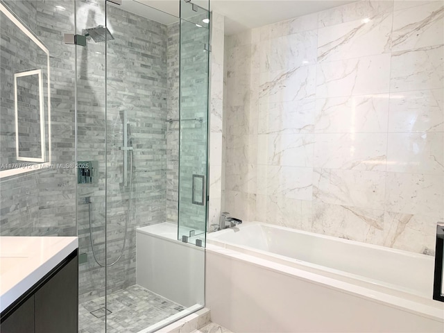851 NE 1st Ave Unit 3905, Miami, FL 33132 - full bath with a shower stall, vanity, tile walls, and a garden tub