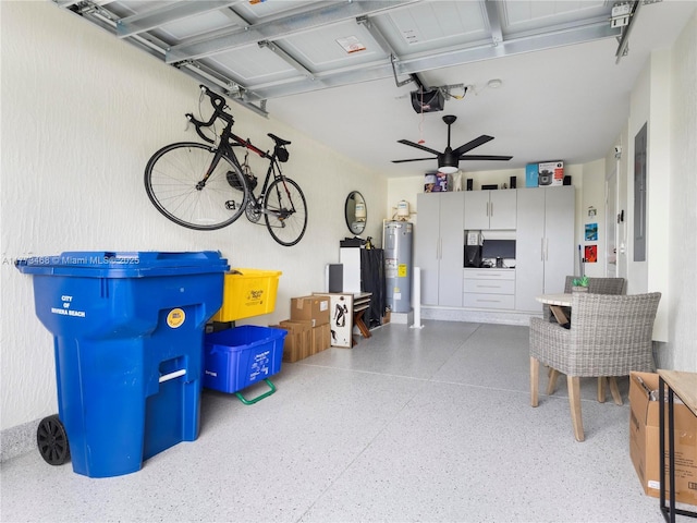 garage with ceiling fan, electric water heater, and a garage door opener