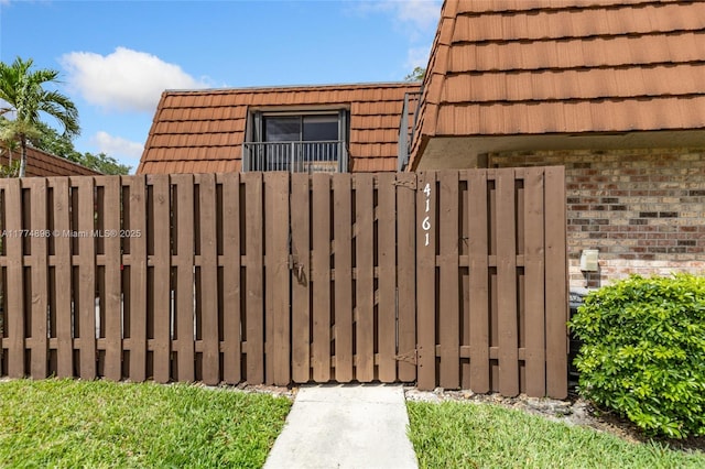 view of gate featuring fence