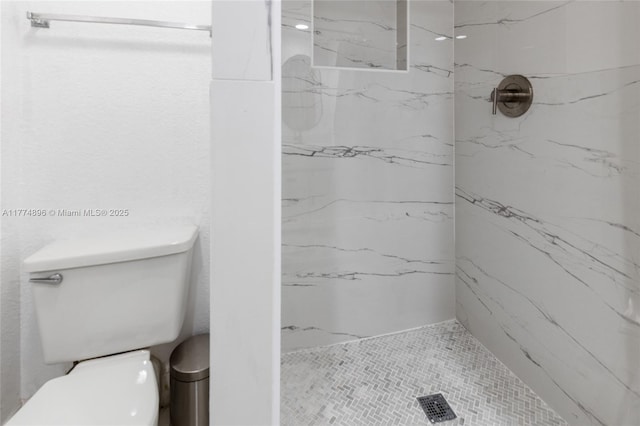 full bathroom with toilet and a marble finish shower