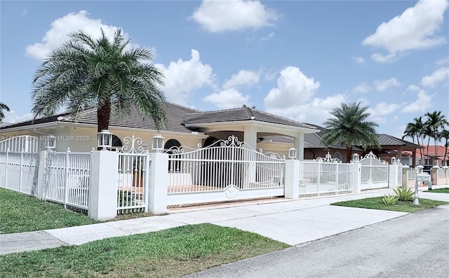 14261 SW 30th St, Miami, FL 33175 - view of front of property featuring a fenced front yard, stucco siding, and a gate