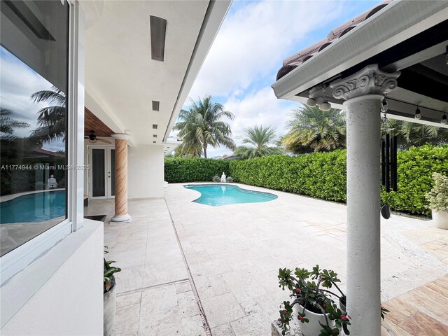 14261 SW 30th St, Miami, FL 33175 - view of swimming pool featuring a patio area