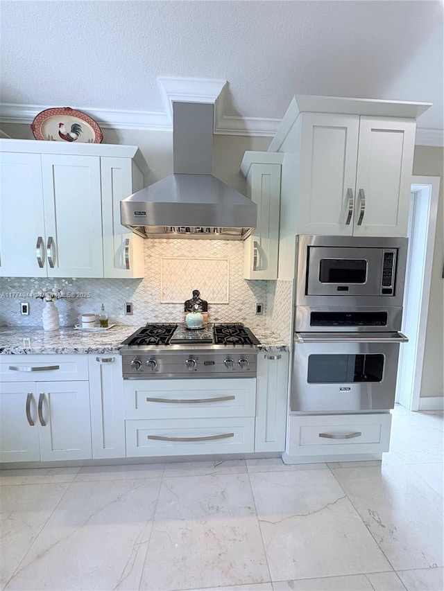 14261 SW 30th St, Miami, FL 33175 - kitchen with stainless steel appliances, wall chimney range hood, ornamental molding, light stone countertops, and light marble finish floors