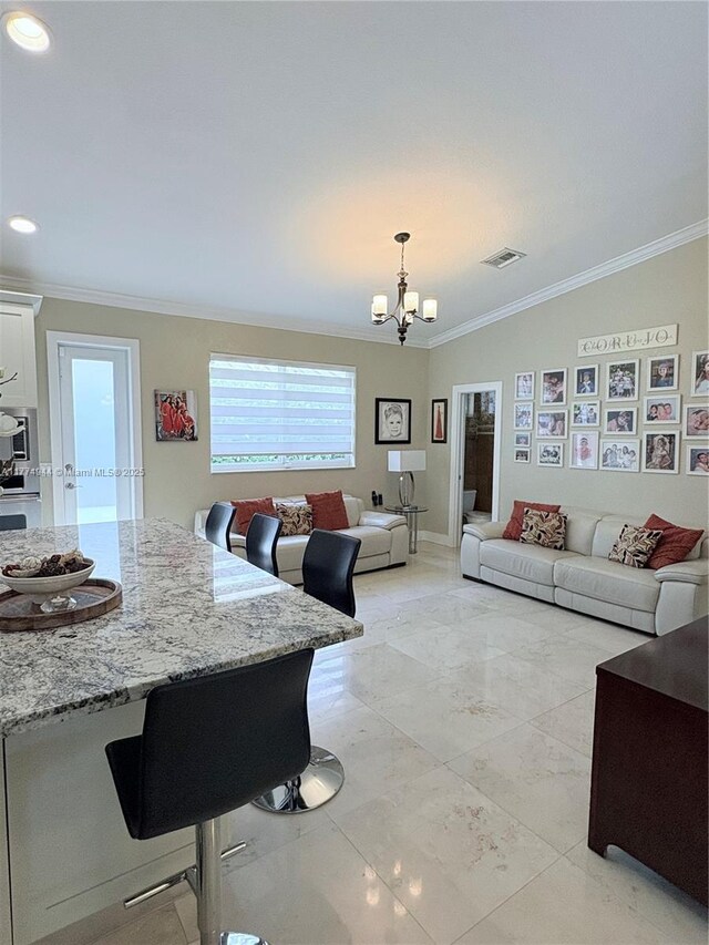 14261 SW 30th St, Miami, FL 33175 - living room with crown molding, a chandelier, and recessed lighting