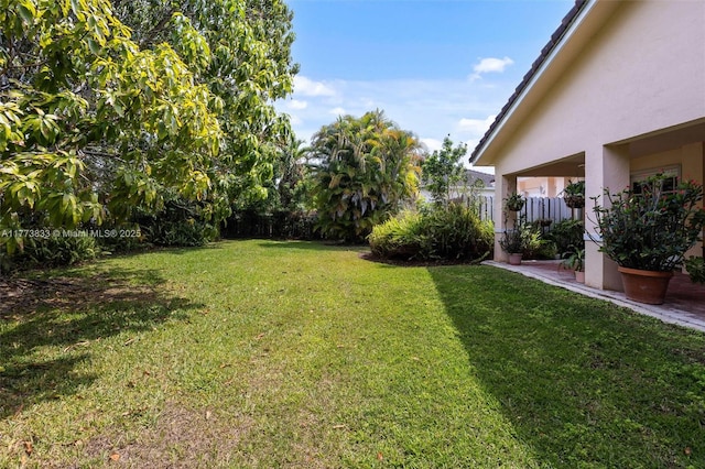 view of yard featuring fence