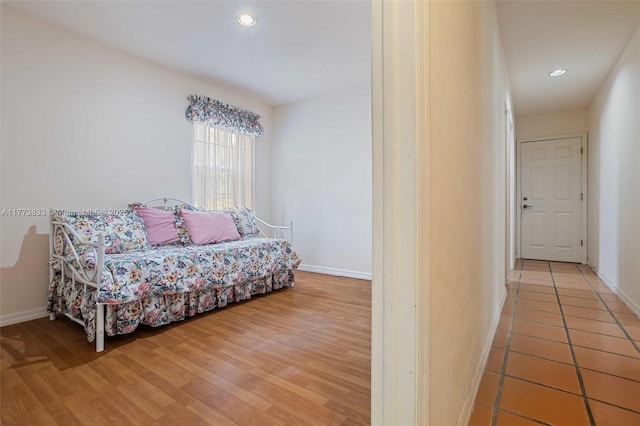 interior space featuring baseboards, recessed lighting, and light wood-style flooring