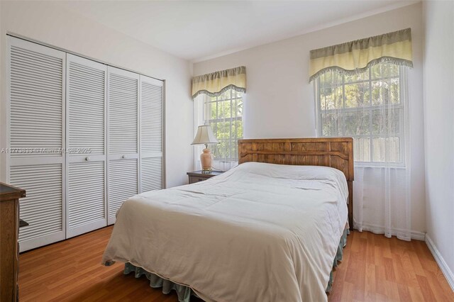 bedroom featuring a closet and wood finished floors
