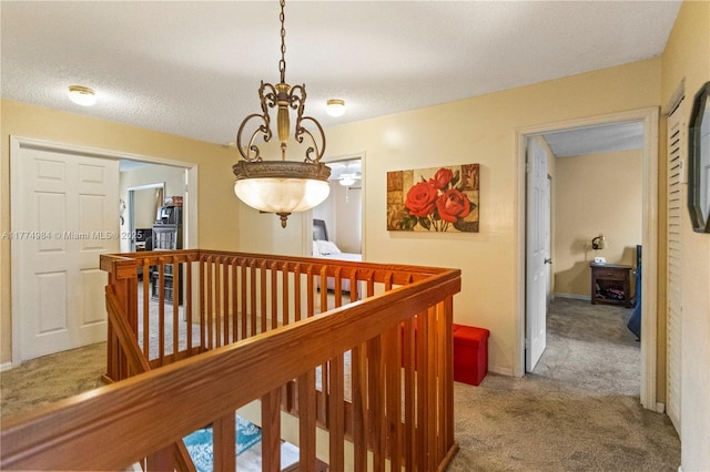 14201 Summersville Pl, Davie, FL 33325 - corridor with carpet, an upstairs landing, a chandelier, and baseboards