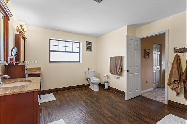 14201 Summersville Pl, Davie, FL 33325 - full bath featuring vanity, wood finished floors, baseboards, and toilet