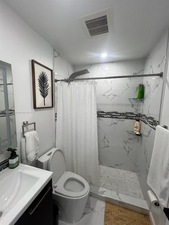 full bathroom with visible vents, a stall shower, toilet, and vanity