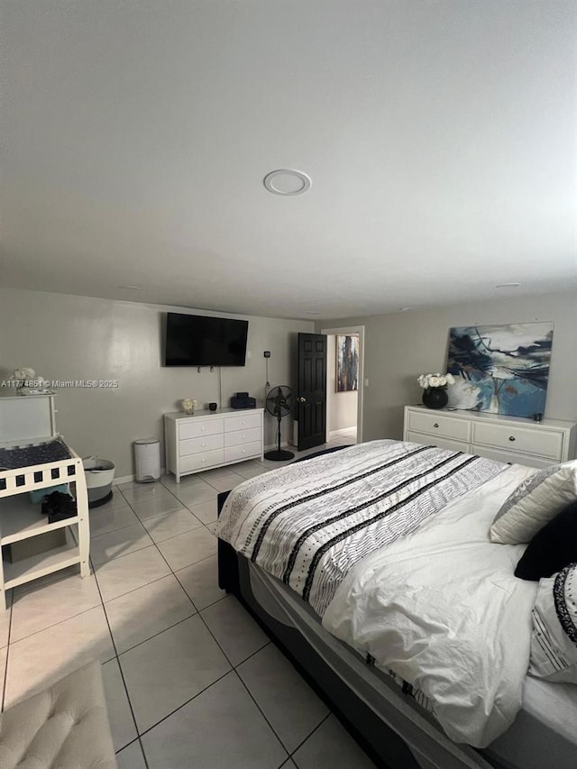 bedroom with light tile patterned floors