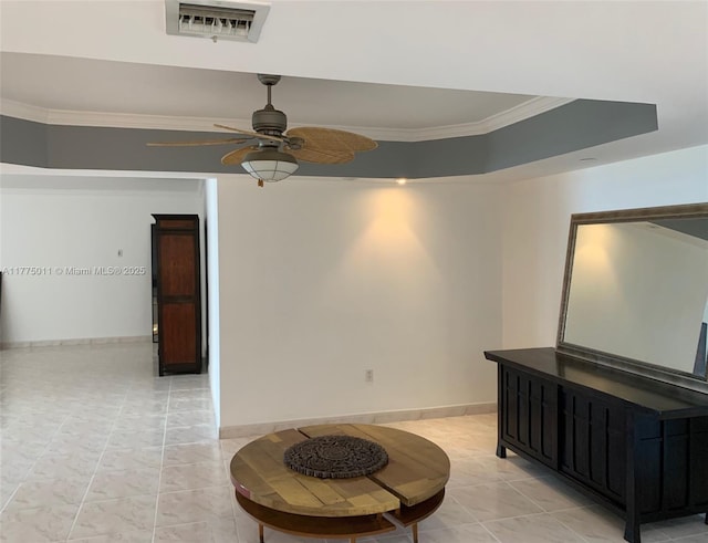 interior space featuring visible vents, baseboards, a ceiling fan, and crown molding