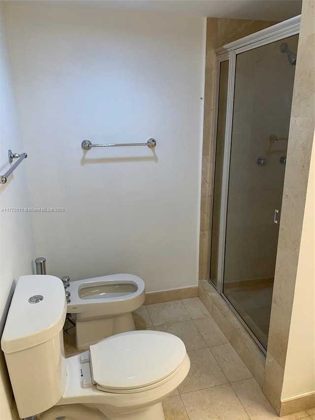 full bathroom featuring a bidet, baseboards, a stall shower, tile patterned flooring, and toilet