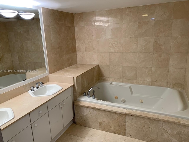 bathroom featuring tile patterned floors, double vanity, a sink, and a tub with jets