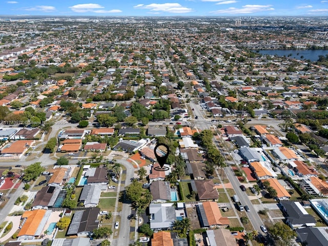 bird's eye view featuring a residential view and a water view