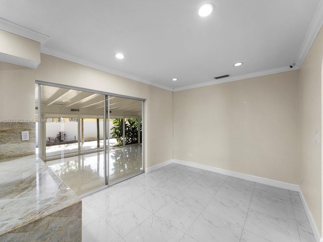 empty room with marble finish floor, ornamental molding, baseboards, and recessed lighting