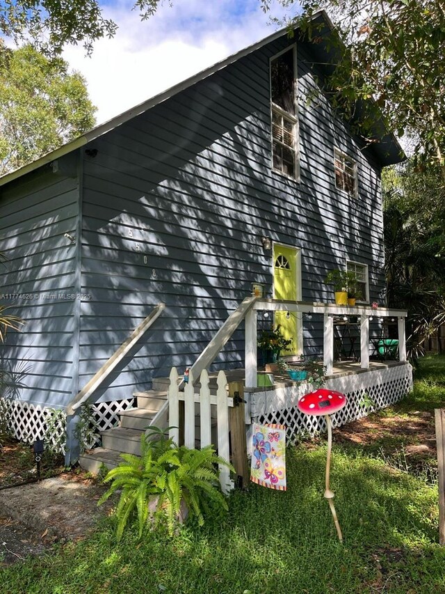 5508 Spruce Dr, Fort Pierce, FL 34982 - rear view of house featuring a deck