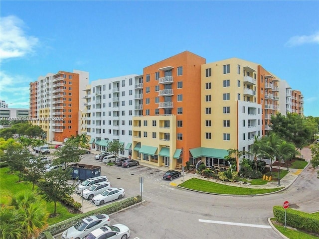 view of property featuring uncovered parking