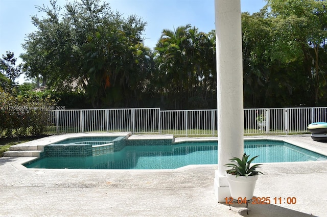 12044 NW 9th Pl, Coral Springs, FL 33071 - view of pool featuring a patio area, a fenced backyard, and a pool with connected hot tub