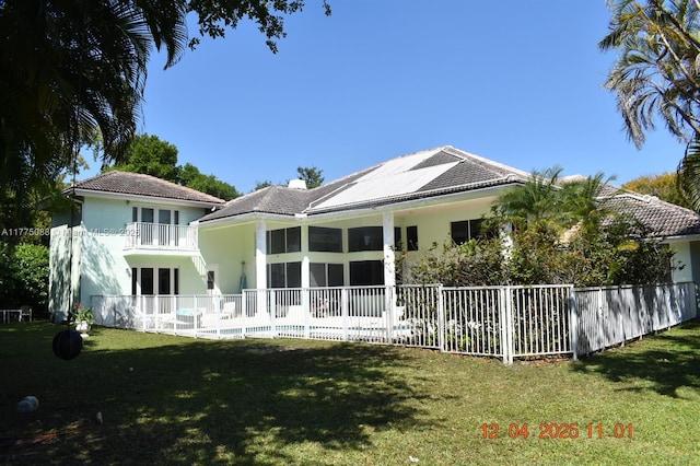 12044 NW 9th Pl, Coral Springs, FL 33071 - rear view of property with a tiled roof, stucco siding, a lawn, fence, and a balcony