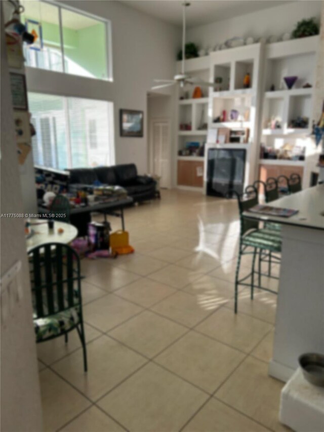 12044 NW 9th Pl, Coral Springs, FL 33071 - living room with light tile patterned floors and ceiling fan