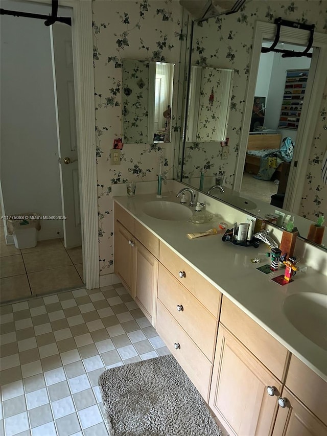 12044 NW 9th Pl, Coral Springs, FL 33071 - ensuite bathroom with tile patterned floors, ensuite bath, a sink, and wallpapered walls