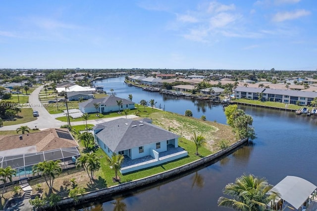 birds eye view of property featuring a residential view and a water view