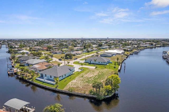 aerial view with a water view and a residential view