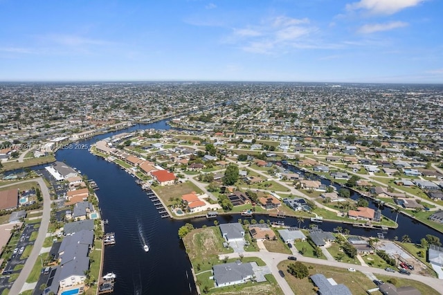 birds eye view of property featuring a residential view and a water view