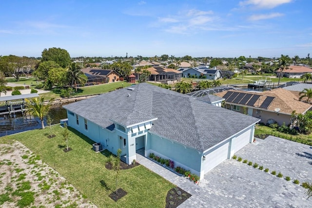 bird's eye view featuring a residential view and a water view
