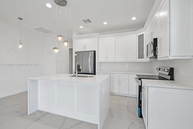kitchen featuring white cabinetry, marble finish floor, appliances with stainless steel finishes, and visible vents