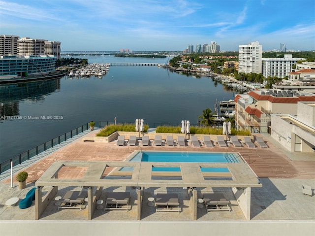 view of urban area featuring a nearby body of water