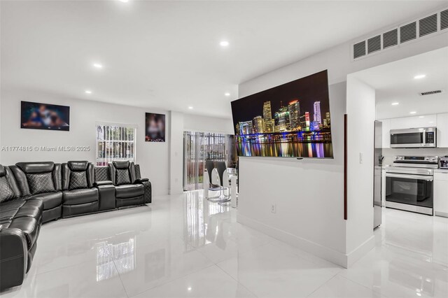 8775 Park Blvd Unit 111, Miami, FL 33172 - living room featuring visible vents, recessed lighting, and light tile patterned floors