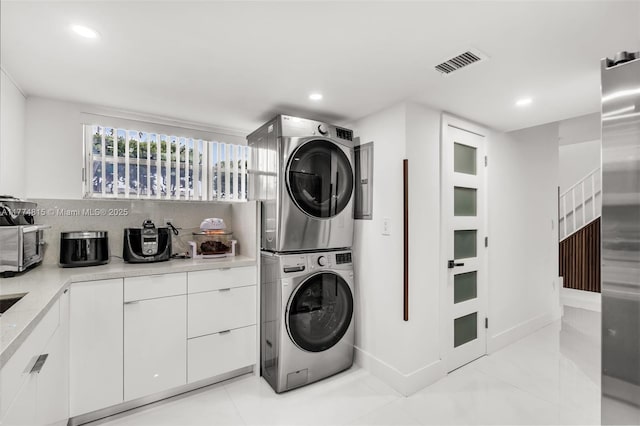 8775 Park Blvd Unit 111, Miami, FL 33172 - clothes washing area featuring stacked washer and dryer, laundry area, visible vents, and recessed lighting