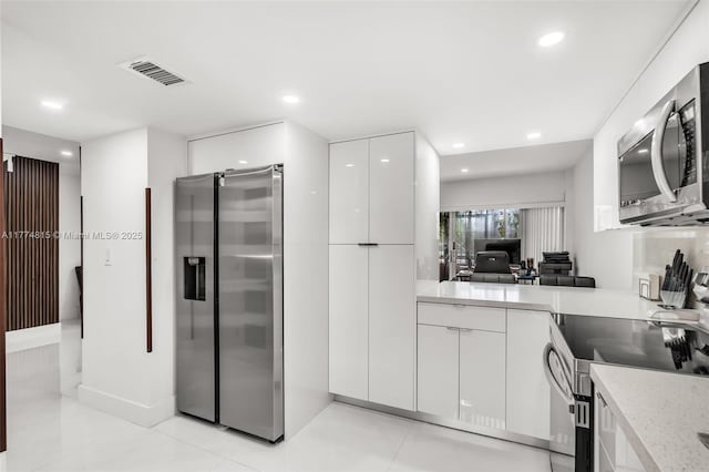 8775 Park Blvd Unit 111, Miami, FL 33172 - kitchen with visible vents, appliances with stainless steel finishes, modern cabinets, recessed lighting, and white cabinetry