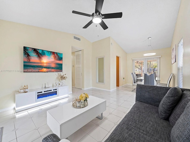 living area with light tile patterned flooring, vaulted ceiling, baseboards, visible vents, and ceiling fan