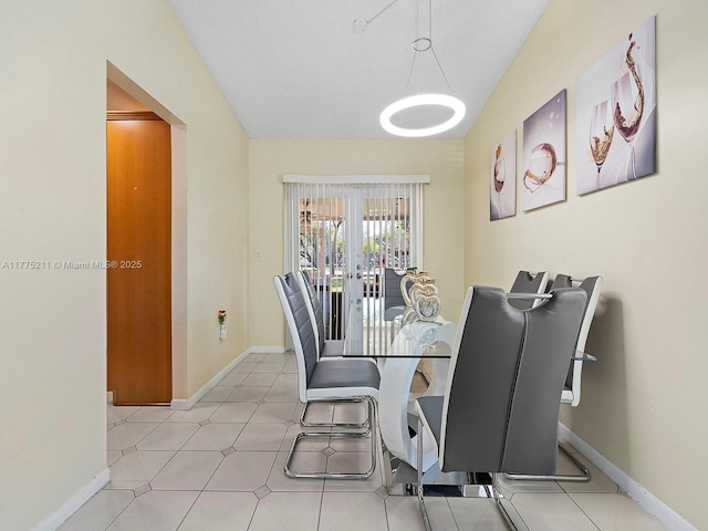 dining room featuring baseboards